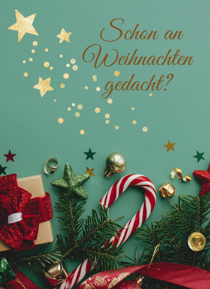 Der Slider zeigt ein Foto von einem weihnachtlichen Hintergrund mit Sternen, Lebkuchen und weihnachtlicher Deko. In goldener Schrift steht "Schon an Weihnachten gedacht?"